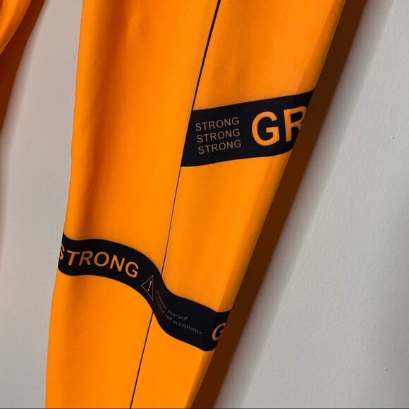 GRRRL Amanda Heather Leggings Orange Black Flex Strong Workout Pants Pocket NWT - Picture 3 of 6